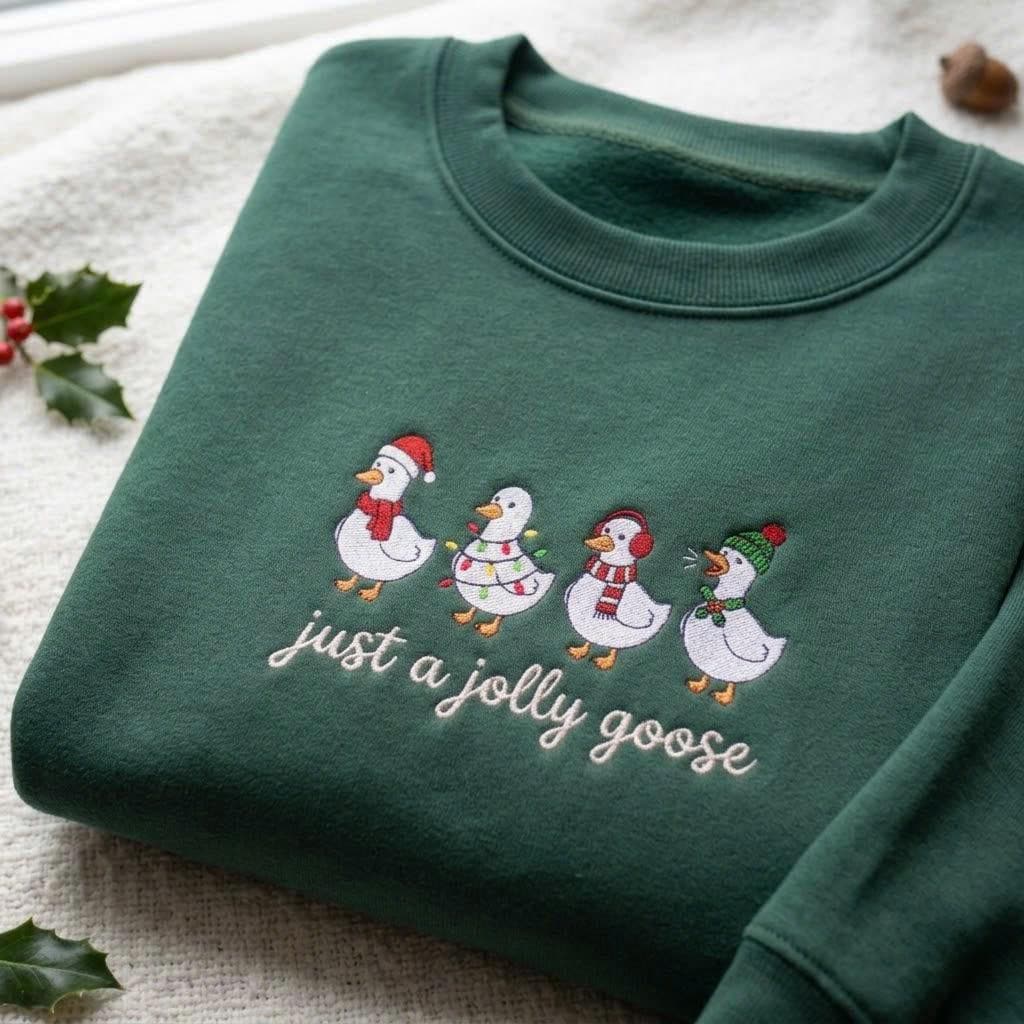 Just A Jolly Goose Christmas Sweatshirt, Green Winter Village Embroidered Crewneck