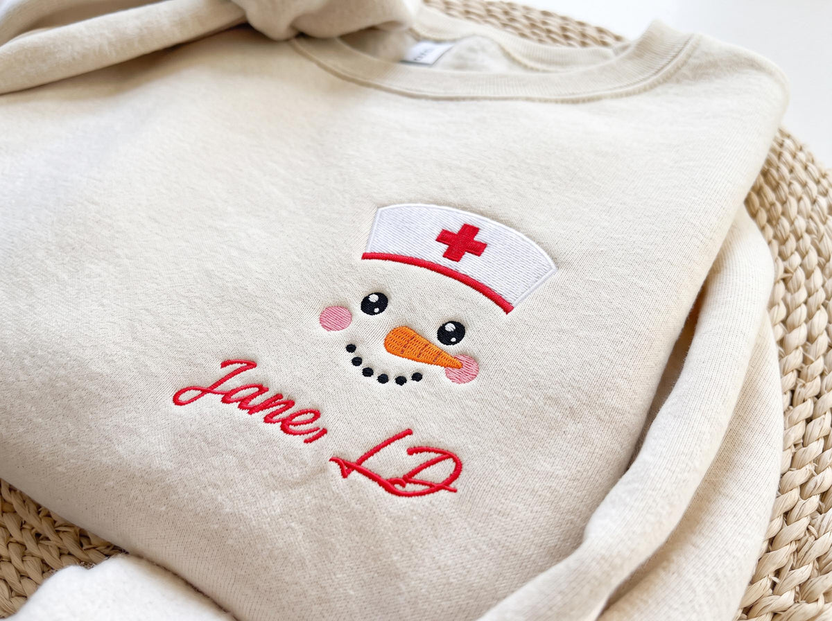 Nurse Snowman Embroidered Christmas Sweatshirt Personalized Name RN LD Holiday Crewneck Gift, Christmas Gift For New Nurse, RN Nurse Gift
