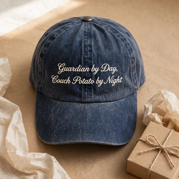 Washed navy cap with Guardian by Day, Couch Potato by Night embroidery, gift presentation
